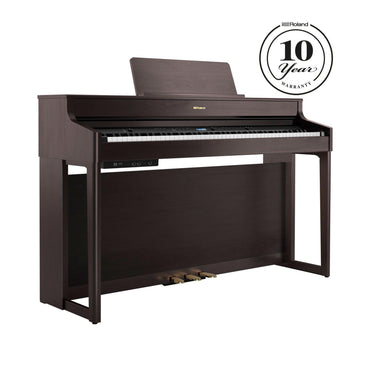 Digitalpiano i mørkt trædesign med et stilrent og moderne udtryk.