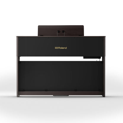 Digitalt klaver i mørkt træ med elegant finish set bagfra med musikstativ