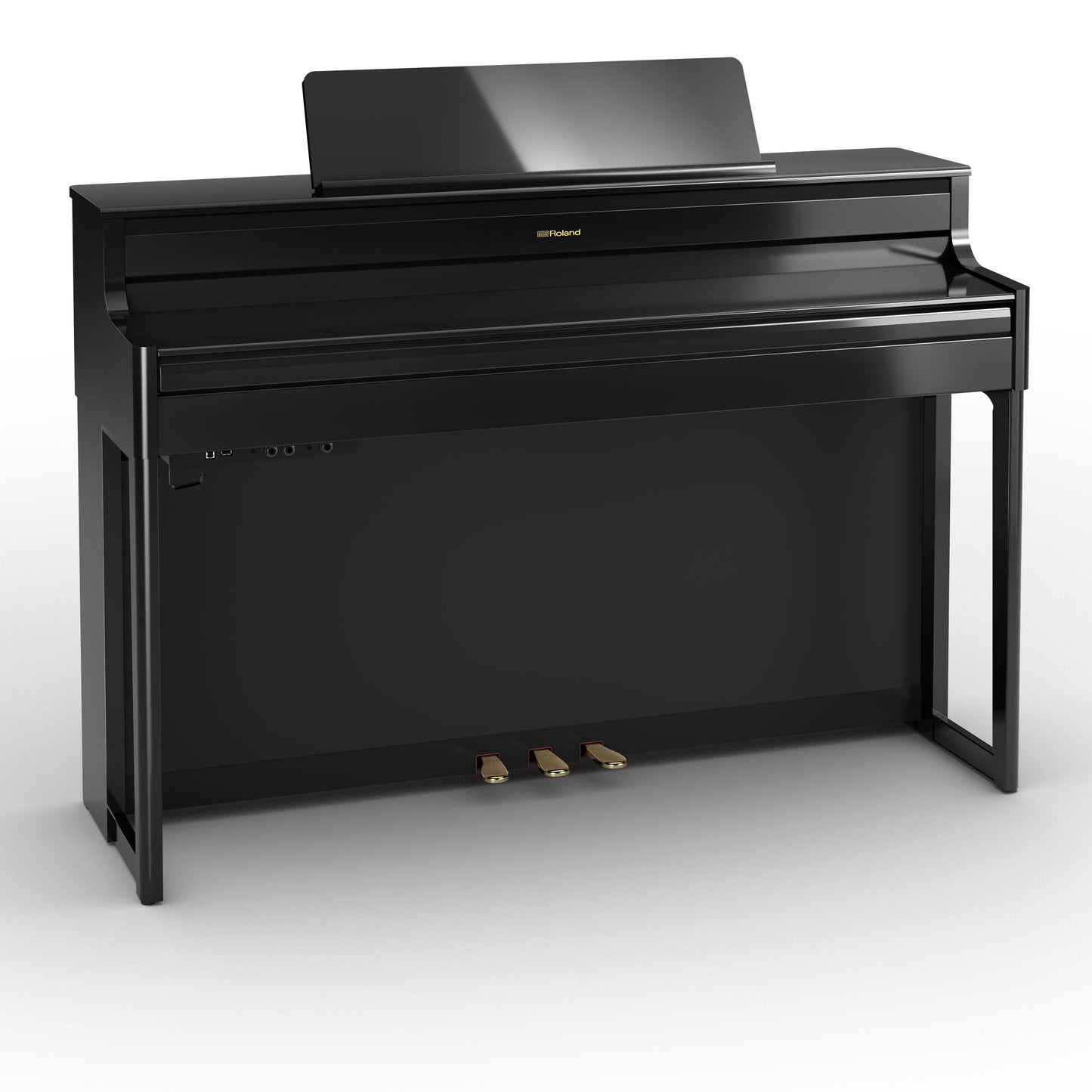 elegant sort digitalpiano med moderne design og pedaler i messingfinish