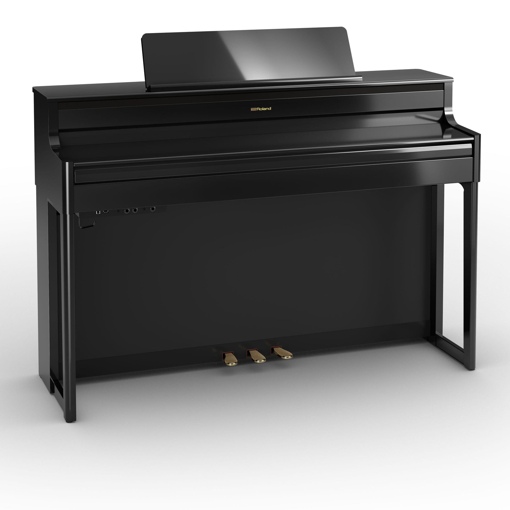 elegant sort digitalpiano med moderne design og pedaler i messingfinish